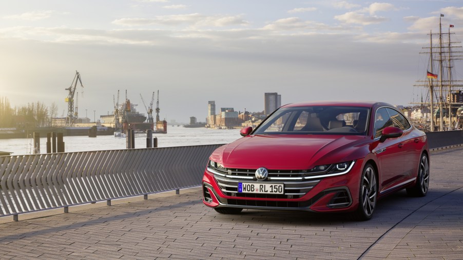 A red 2021 Volkswagen Arteon driving down a street