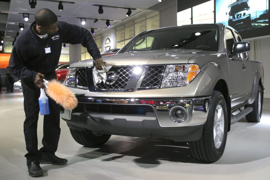 A man polishes a Nissan Frontier