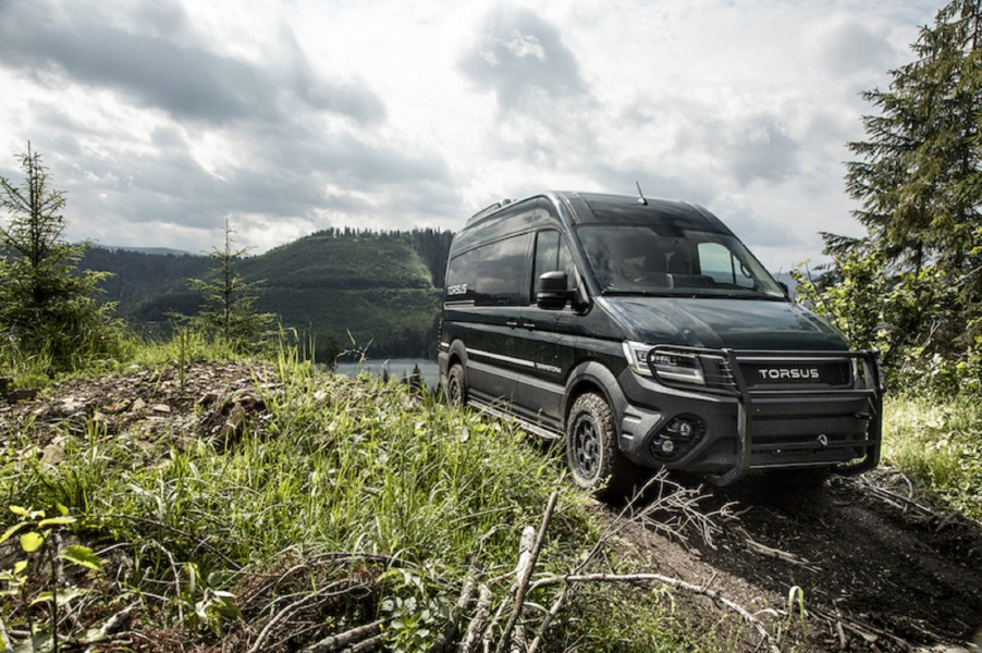 A black Torsus Terrastorm drives on a forest trail