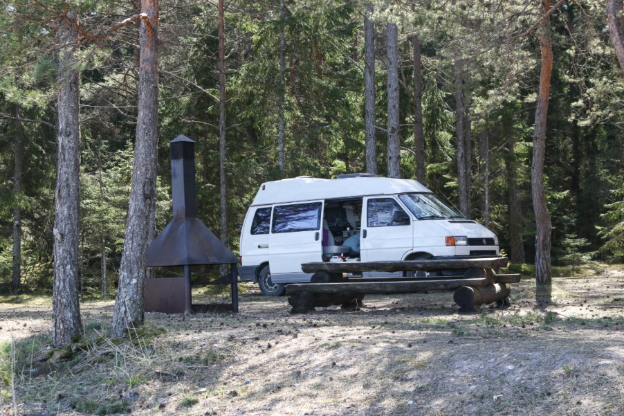 A camper van parked at a camp site