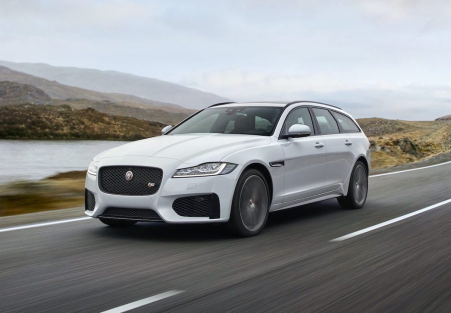 An image of a Jaguar XF driving down the road.