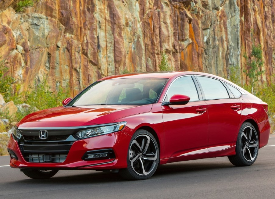 A red 2020 Honda Accord 2.0T Sport by a rocky hill