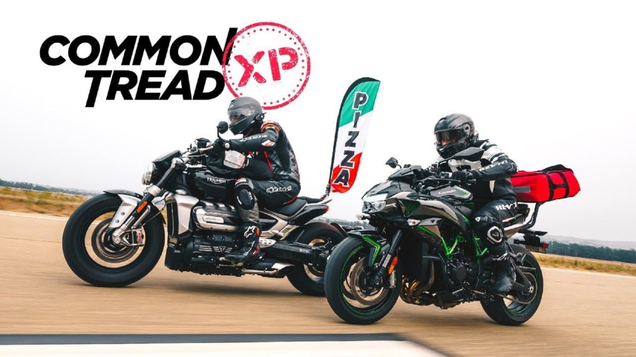 A black 2020 Triumph Rocket 3 races a black-and-green 2020 Kawasaki Z H2