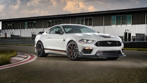 A white 2021 Ford Mustang Mach 1 parked on a race track