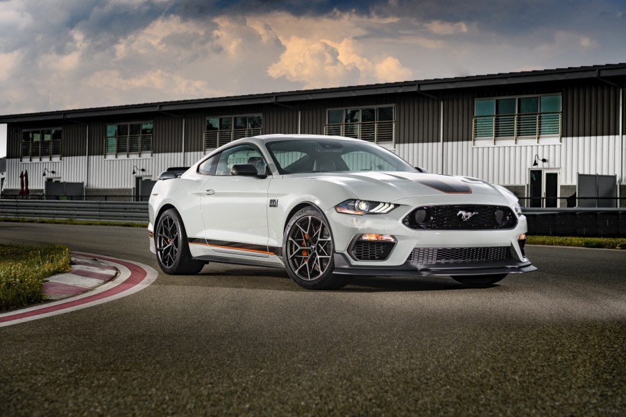 A white 2021 Ford Mustang Mach 1 parked on a race track