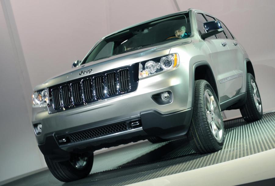 A silver 2011 Jeep Grand Cherokee is unveiled at the New York International Auto Show April 8, 2009, in New York.