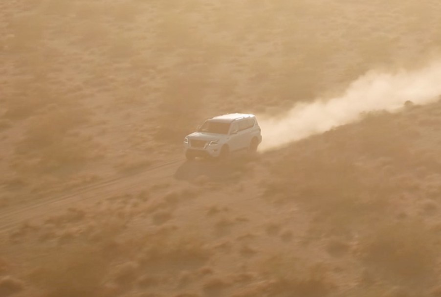 A teaser image of the 2021 Nissan Armada driving through the desert.