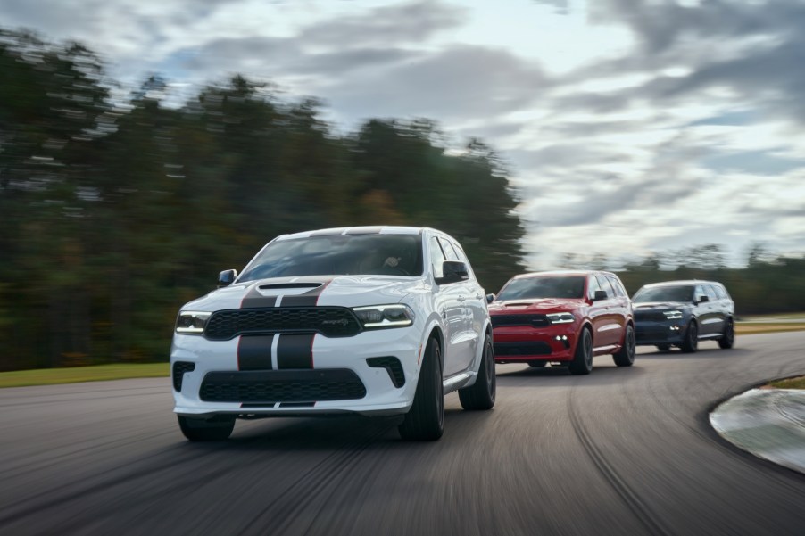 The 2021 Dodge Durango features new aggressive exterior styling, new interior with driver-centric cockpit, new R/T AWD Tow N Go (center) and 710-horsepower SRT Hellcat (left and right).