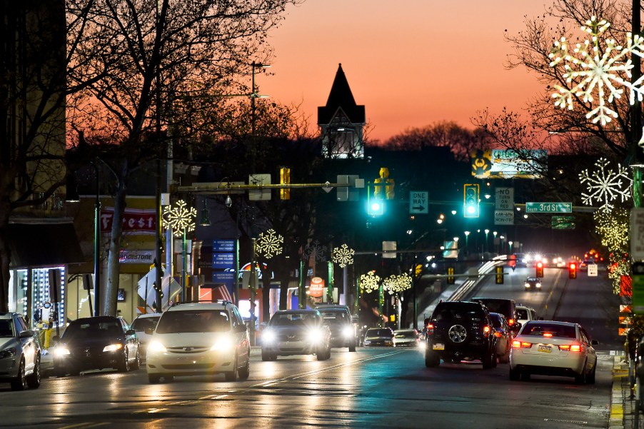 Cars driving at night on the 300 block of Penn Street looking West toward the Penn Street Bridge on December 10, 2020, in Reading, Pennsylvania