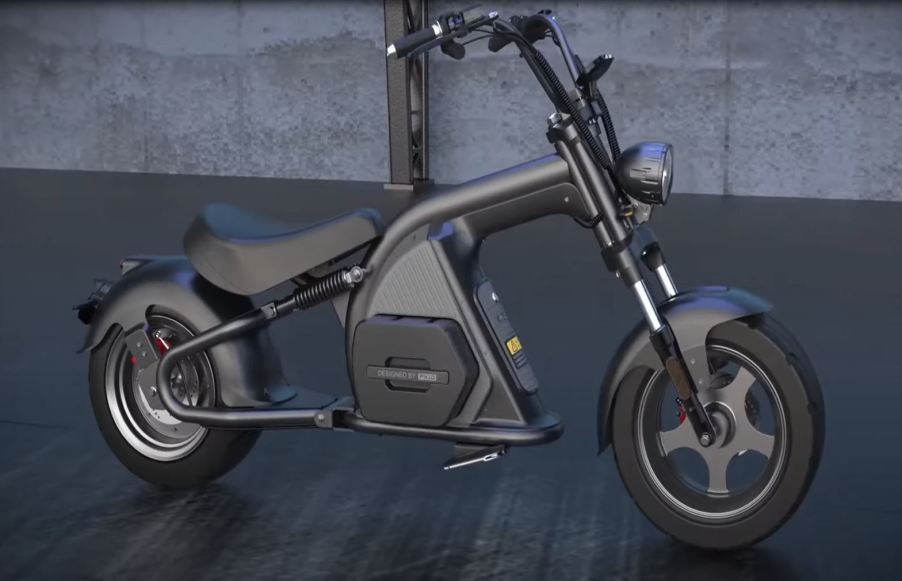 This gunmetal and black electric scooter looks like a motorcycle chopper.