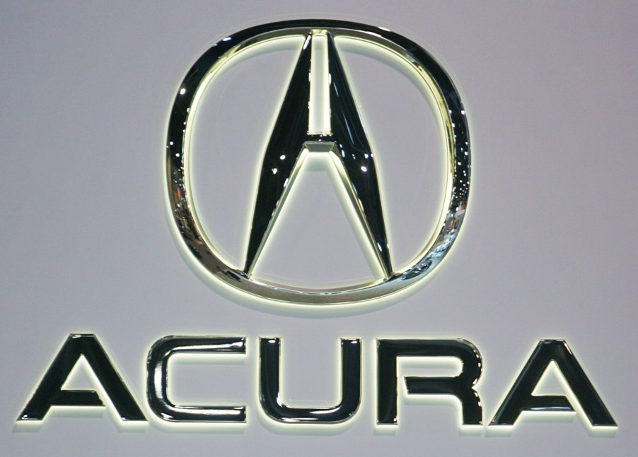 A sign displaying the Acura logo