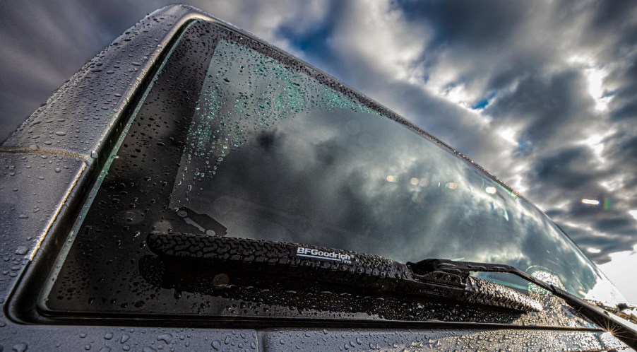 BFGoodrich Off-Road Wiper blades on a rain-streaked gray-blue Jeep Wrangler