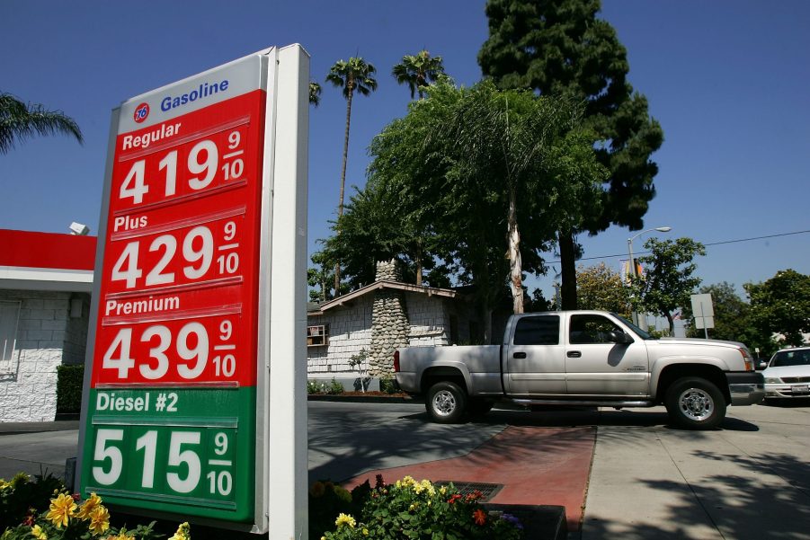 A diesel truck pulling out of a gas station