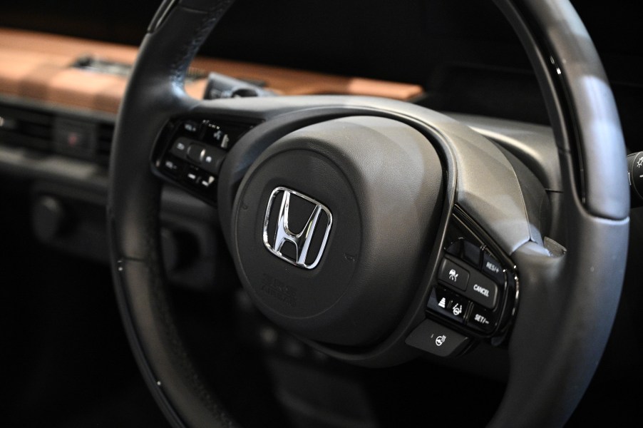 A Honda logo is pictured on a displayed car at a Honda showroom of company headquarters in Tokyo on November 6, 2020.