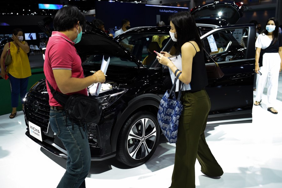 People inspect NISSAN KICKS during the 41st Bangkok International Motor Show 2020