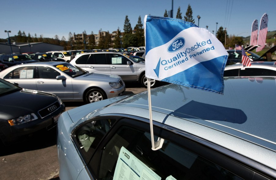 A certified pre-owned flag is seen on a used car for sale at Novato Ford March 20, 2009, in Novato, California