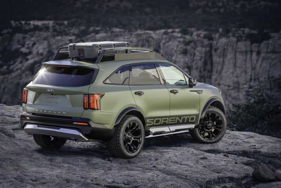 A green 2021 Kia Sorento Yosemite Edition parked on a rocky clif