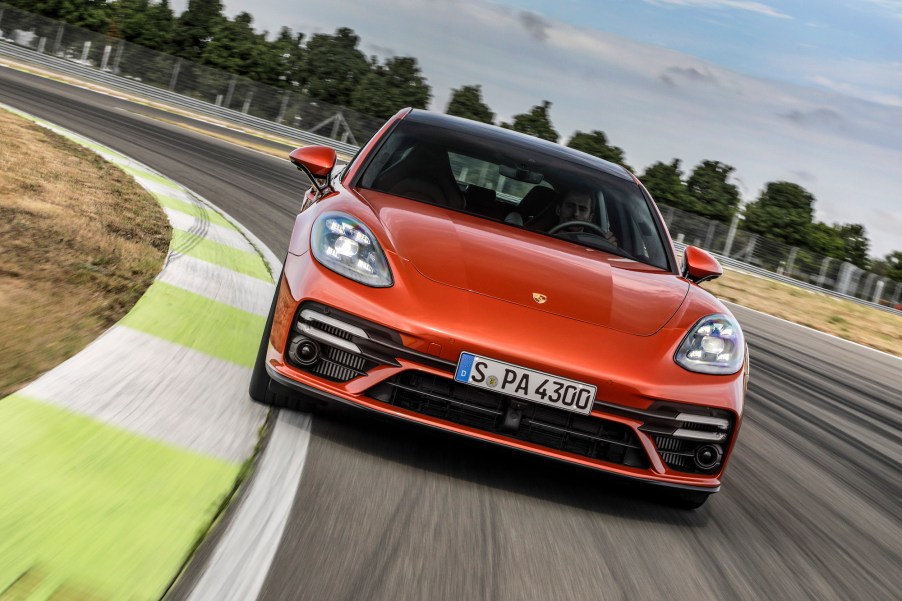 A burnt-orange 2021 Porsche Panamera travels on a racetrack