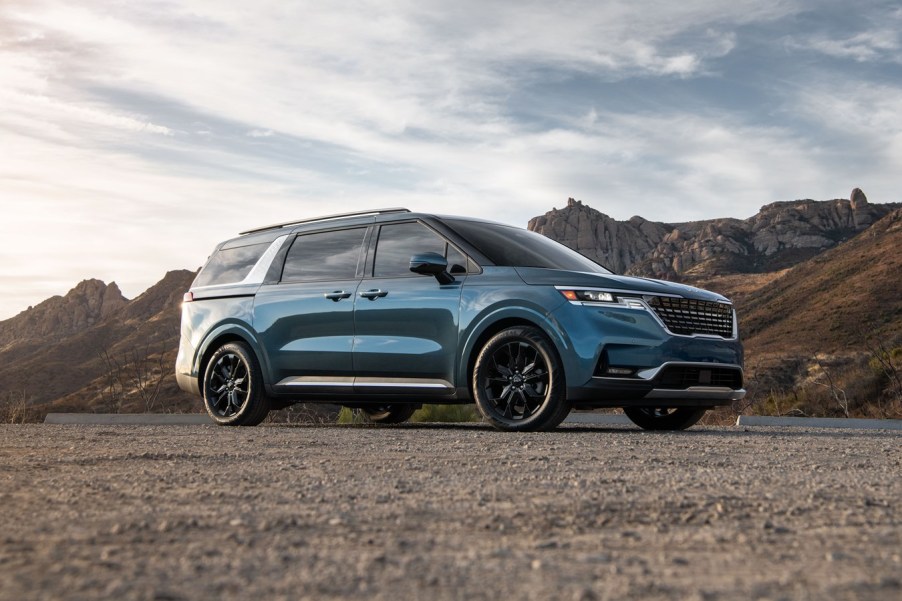 An image of a 2022 Kia Carnival parked outside.