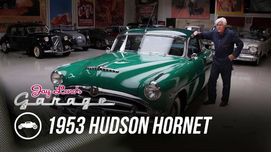 Jay Leno with his green 1953 Hudson Hornet coupe