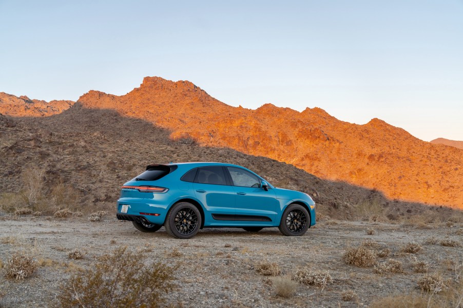 Miami Blue 2021 Porsche Macan GTS ripping through a canyon