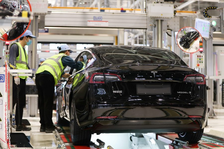 Employees work at the Tesla Gigafactory in Shanghai, east China, Nov. 20, 2020. U.S. electric car company Tesla in 2019 built its first Gigafactory outside the United States to assemble the Tesla Model 3