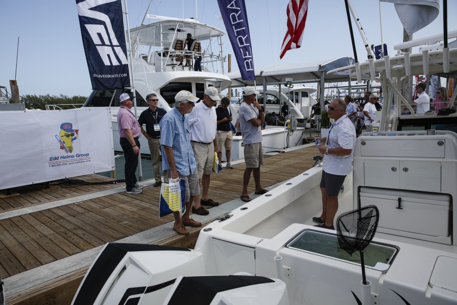 People view yachts during the Miami International Boat Show in Miami, Florida, on February 14, 2020.