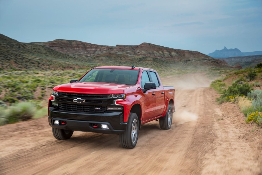 An image of a red 2021 Chevrolet Silverado on a dirt road.