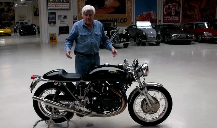 Jay Leno in his garage with his black Egli-Vincent by Godet