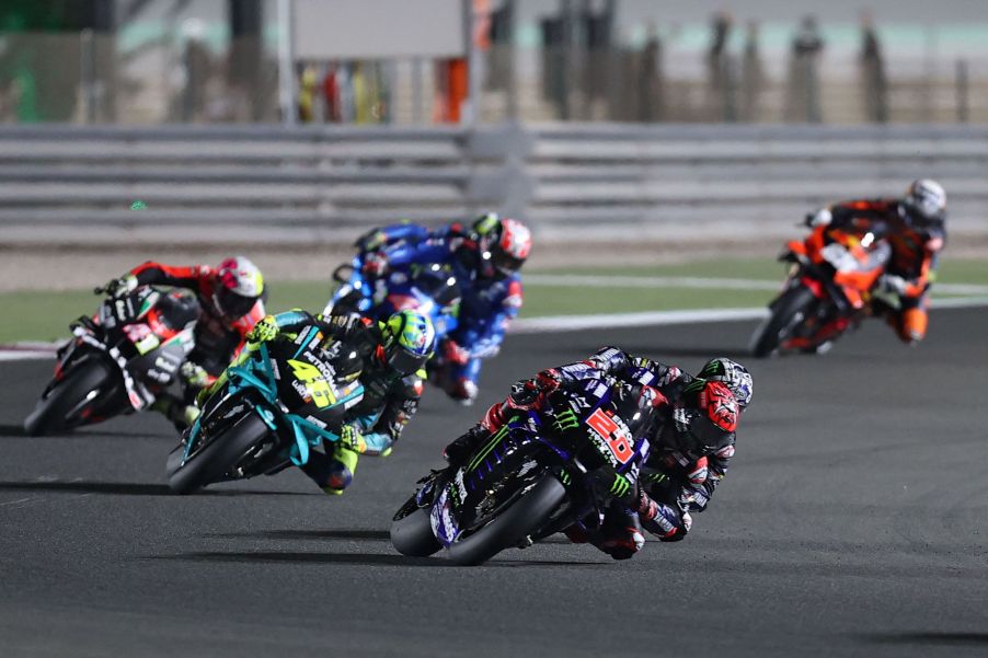 Monster Energy Yamaha racer Fabio Quartararo leads a pack of MotoGP riders at the 2021 Qatar GP