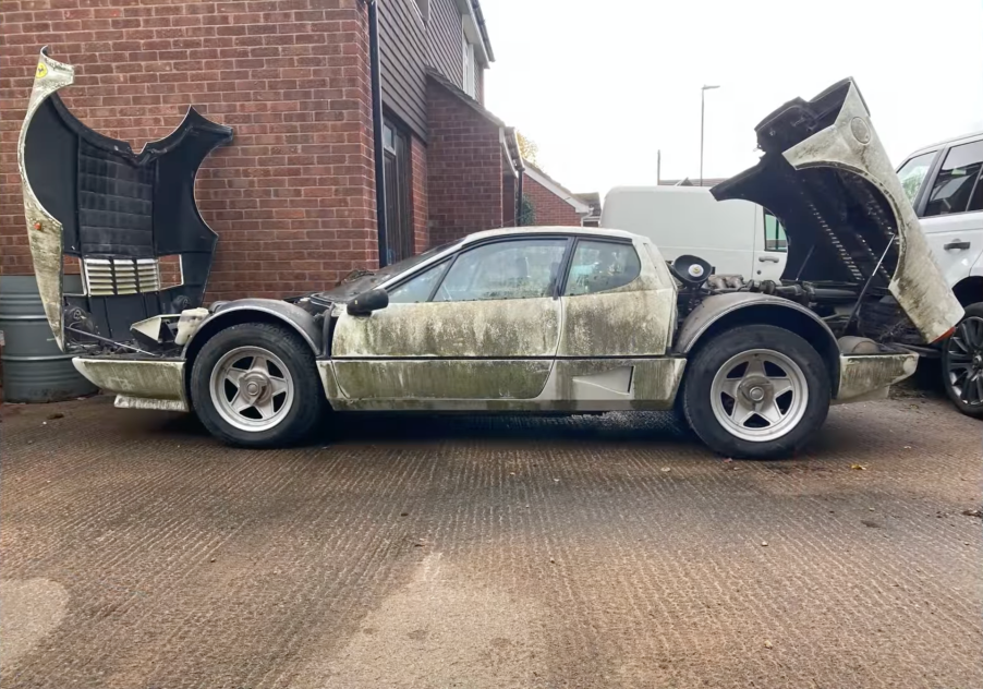 An image of a Ferrari 512 BBi parked outside.