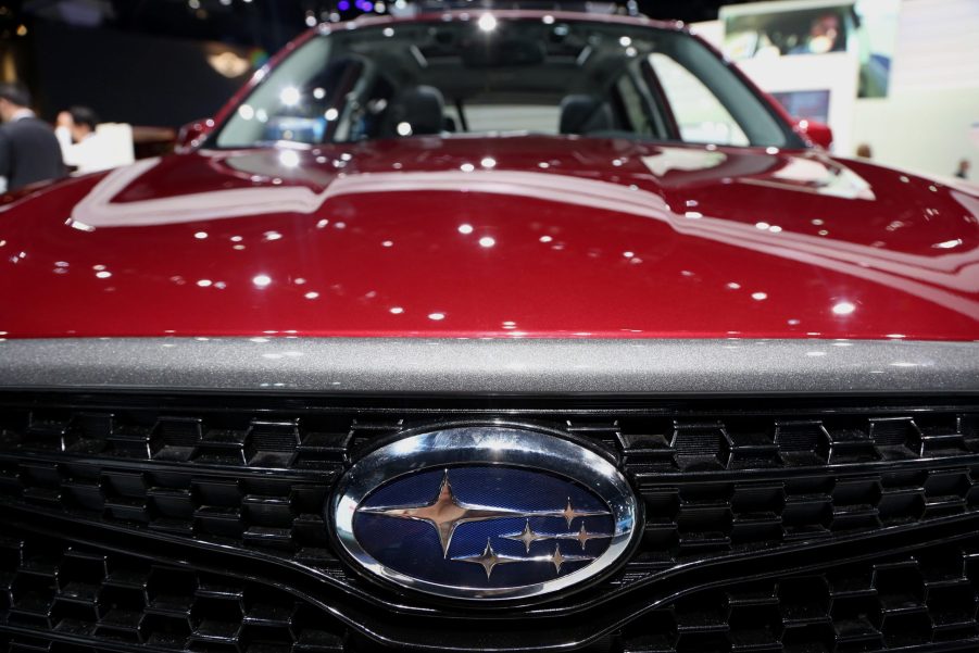 A red Subaru Forester on display at an auto show