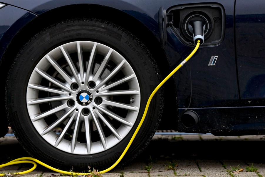 A plug-in hybrid BMW car with an electricity charger