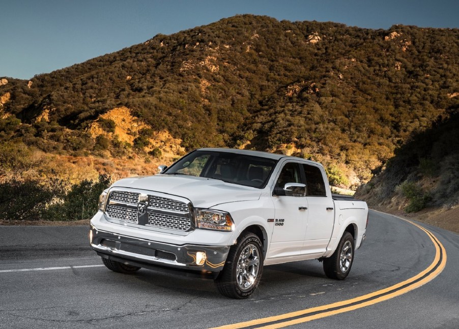 A white 2014 Ram 1500 EcoDiesel on a desert mountain road