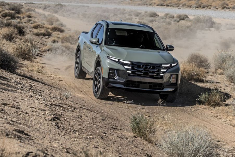 The 2022 Hyundai Santa Cruz driving on a dirt road