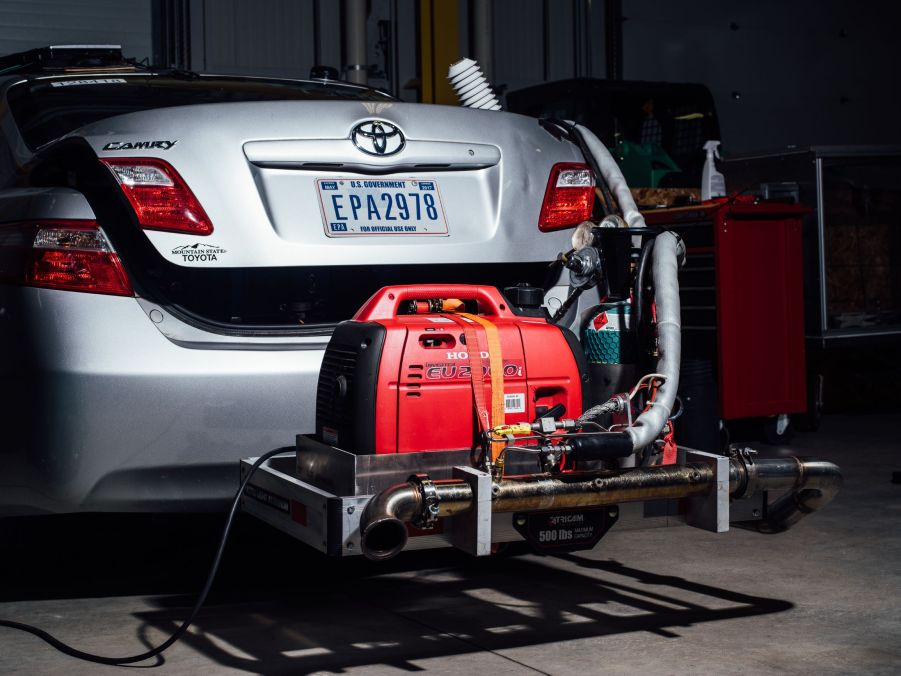 A silver Toyota Camry undergoing emissions tests at an EPA facility