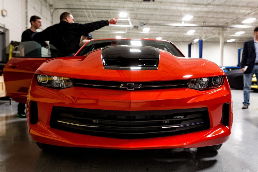 Tour attendees view a General Motors Co. Chevrolet COPO Camaro inside the company's build center in Oxford, Michigan, U.S.