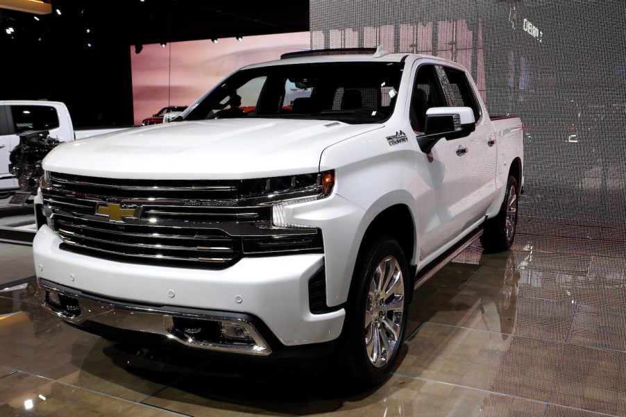 A white Chevy Silverado pictured at an auto show.