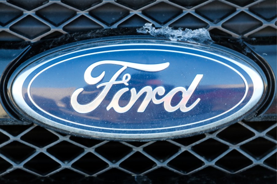 A Ford logo on the front grille of an Explorer