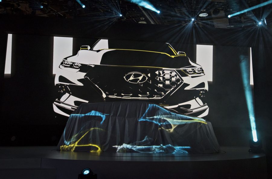 A Hyundai Motor Co. Santa Cruz Concept vehicle sits under a sheet prior to its unveiling during the 2015 North American International Auto Show