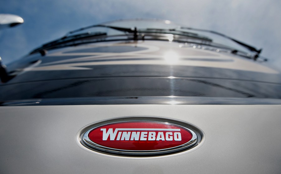 A red Winnebago Industries Inc. logo appears on the front of a 2012 Journey RV at Winnebago Motor Homes in Rockford, Illinois, U.S., on Wednesday, June 13, 2012