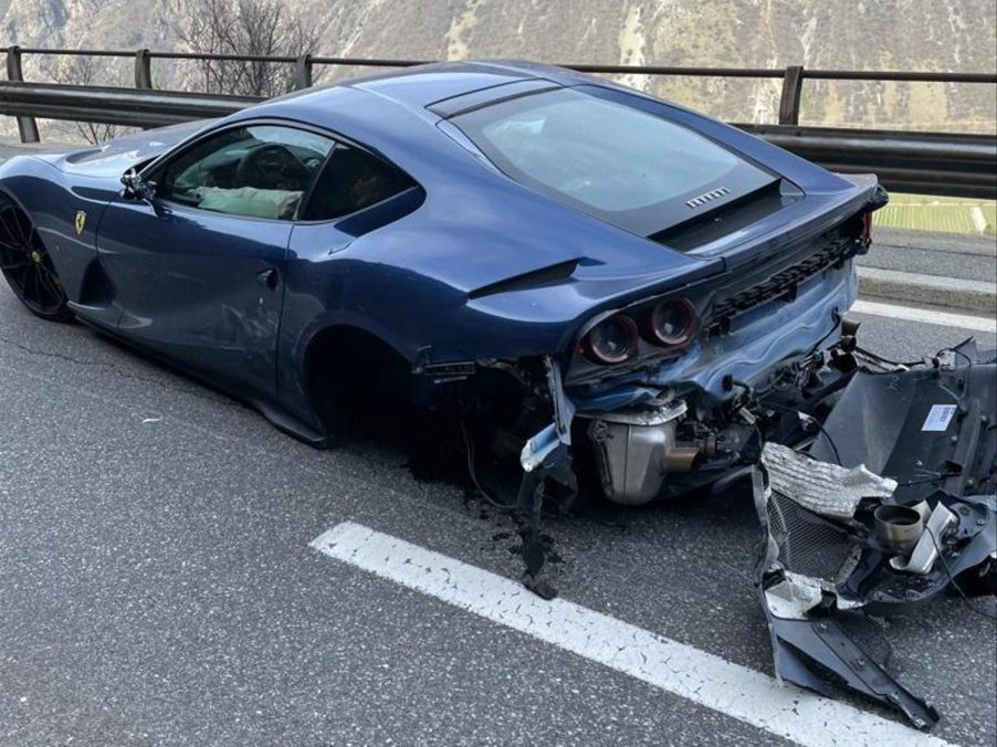 An image of a crashed Ferrari 812 Superfast on the side of the road.