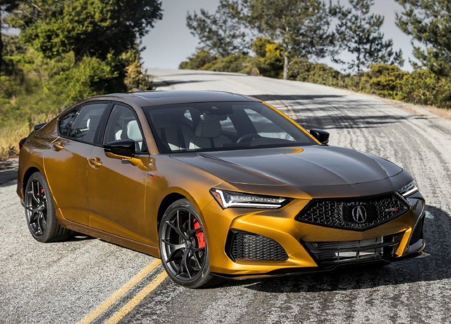 A gold 2021 Acura TLX Type S on a twisting mountain road