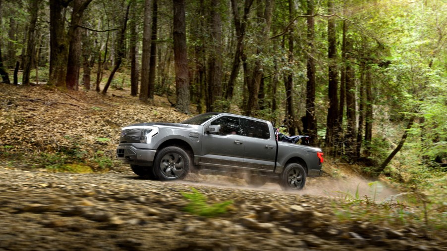 An image of a 2022 Ford F-150 Lightning parked outdoors.