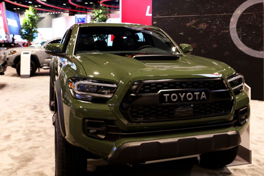 the 2020 Toyota Tacoma trd pro in army green on display at an auto show