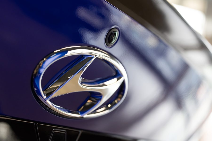 The Hyundai Motor Co. logo is displayed on the trunk of a blue Avante N Line sedan at the company's Motorstudio showroom in Seoul, South Korea