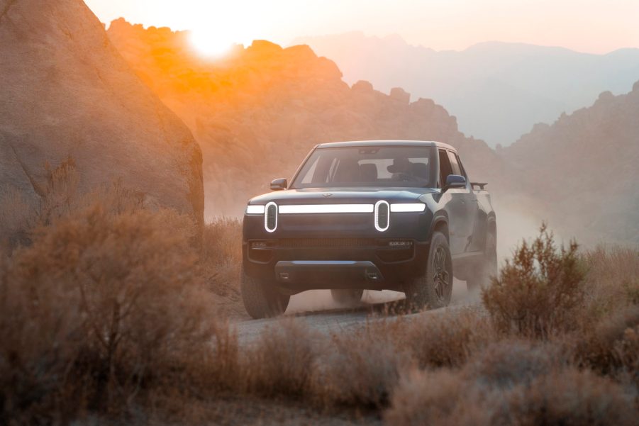 Rivian electric truck parked in a hazy desert