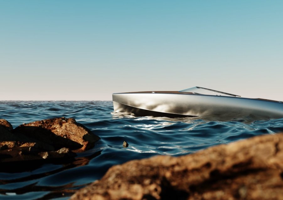 polished aluminum hull floating amongst the rocks