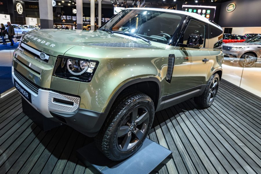 Green Land Rover Defender 90 off-road 4x4 vehicle on display at Brussels Expo