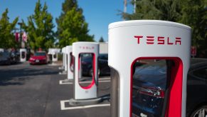 a row of Tesla chargers is great but there arnet enough in America yet to warrant buying your first EV.